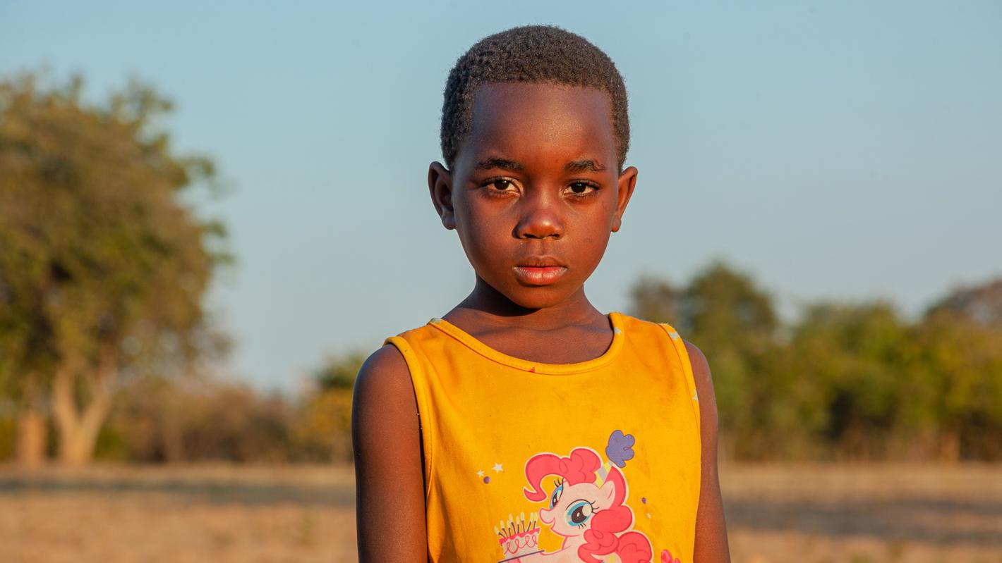 A girl stands in a farm field on 19 June 2024 in Maambo village, Southern province, Zambia.