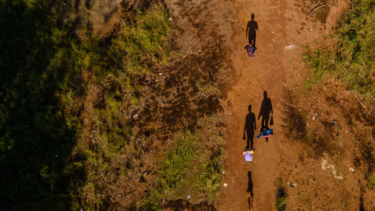 Children walking on desert.
