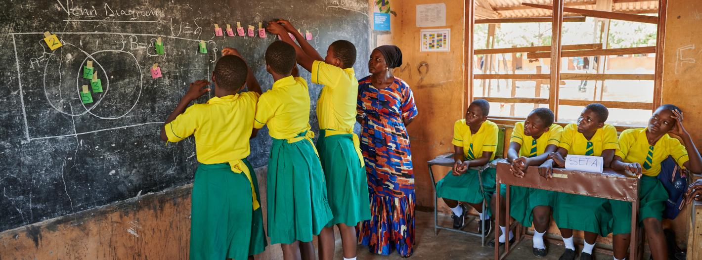 Children writing on the board.